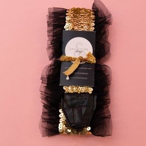 Sam and Kate Design gold camera strap with black ruffle